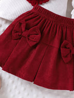 طقم قطعتين للبنات الصغيرات، ربيعي/خريفي، يتكون من تيشيرت بأكمام طويلة منفوخة مزين بنقشة قلوب ثلاثية الأبعاد وتنورة من قماش الكوردروي مزينة بفيونكة.