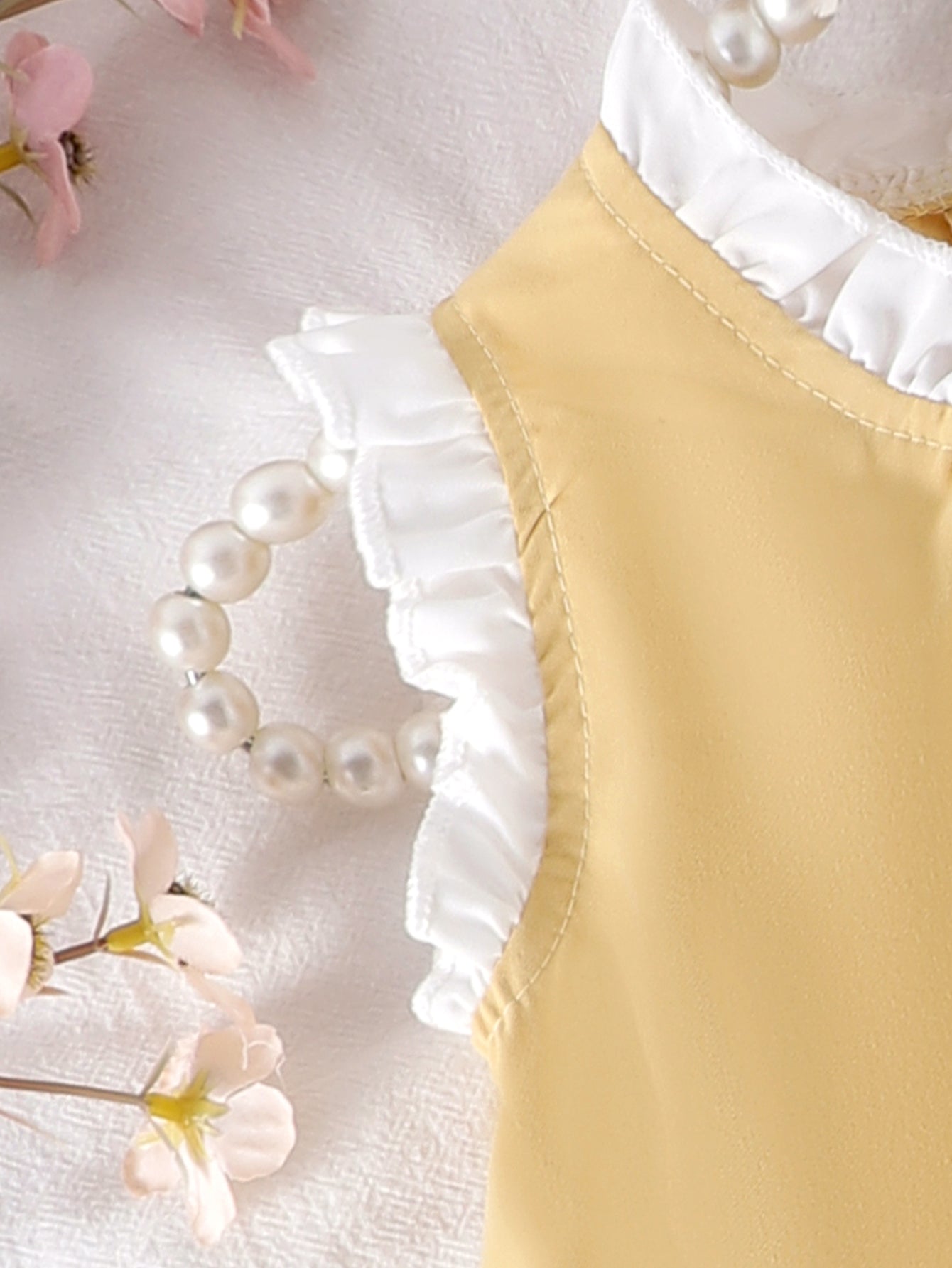 Baby Girls Yellow Sleeveless Ruffle
Dress