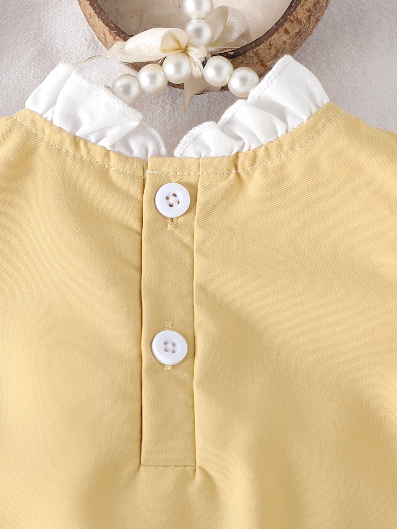 Baby Girls Yellow Sleeveless Ruffle
Dress