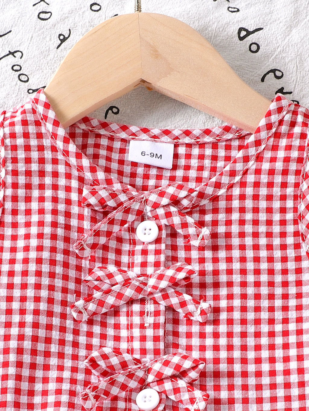 طقم بناتي أحمر بدون أكمام مزين بفيونكة وبنطال كاروهات