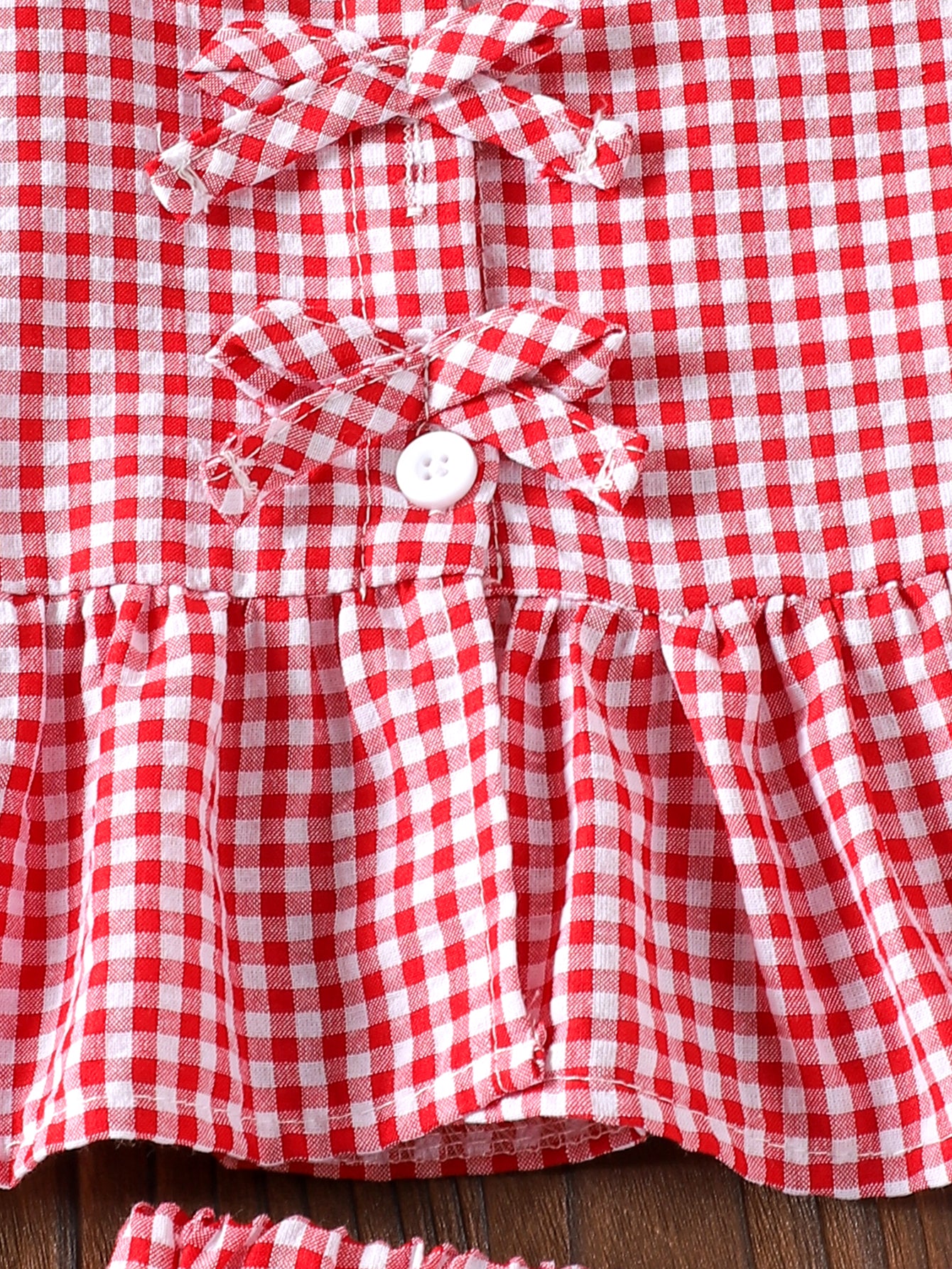 طقم بناتي أحمر بدون أكمام مزين بفيونكة وبنطال كاروهات