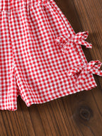 طقم بناتي أحمر بدون أكمام مزين بفيونكة وبنطال كاروهات