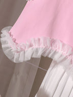 طقم مكون من ثلاث قطع للبنات الصغيرات: بلوزة وردية بدون أكمام بتصميم غير منتظم وتنورة طويلة مطوية مع حقيبة واحدة